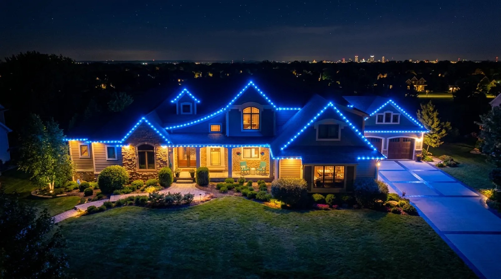 Example of blue permanent roofline lights outlining every roofline of a home