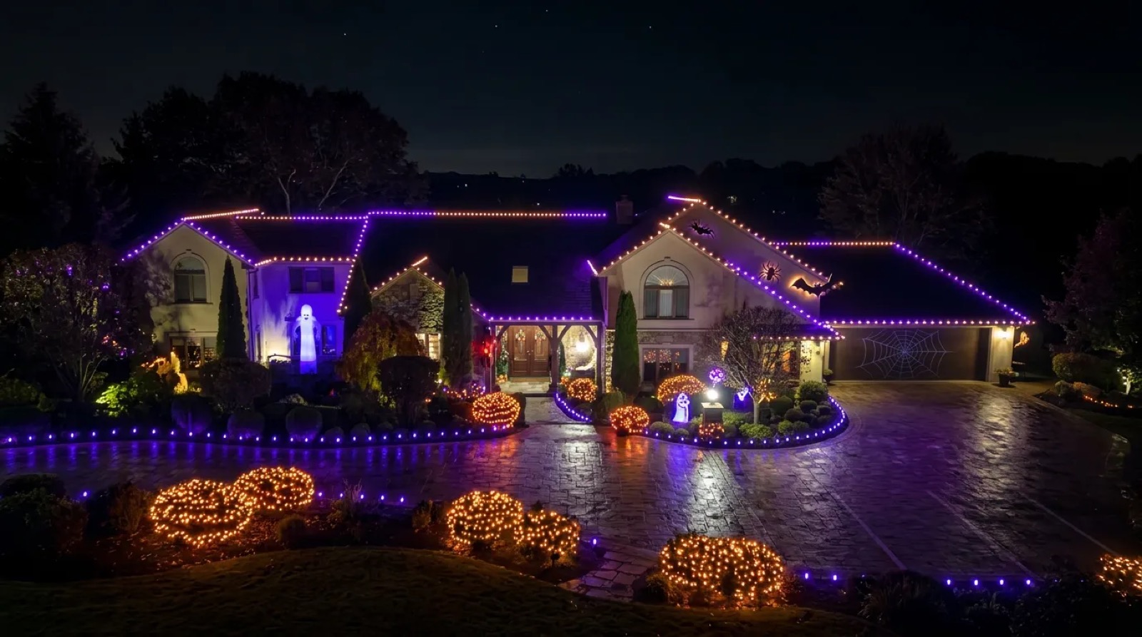 Example of purple and orange Halloween roofline lighting on a home